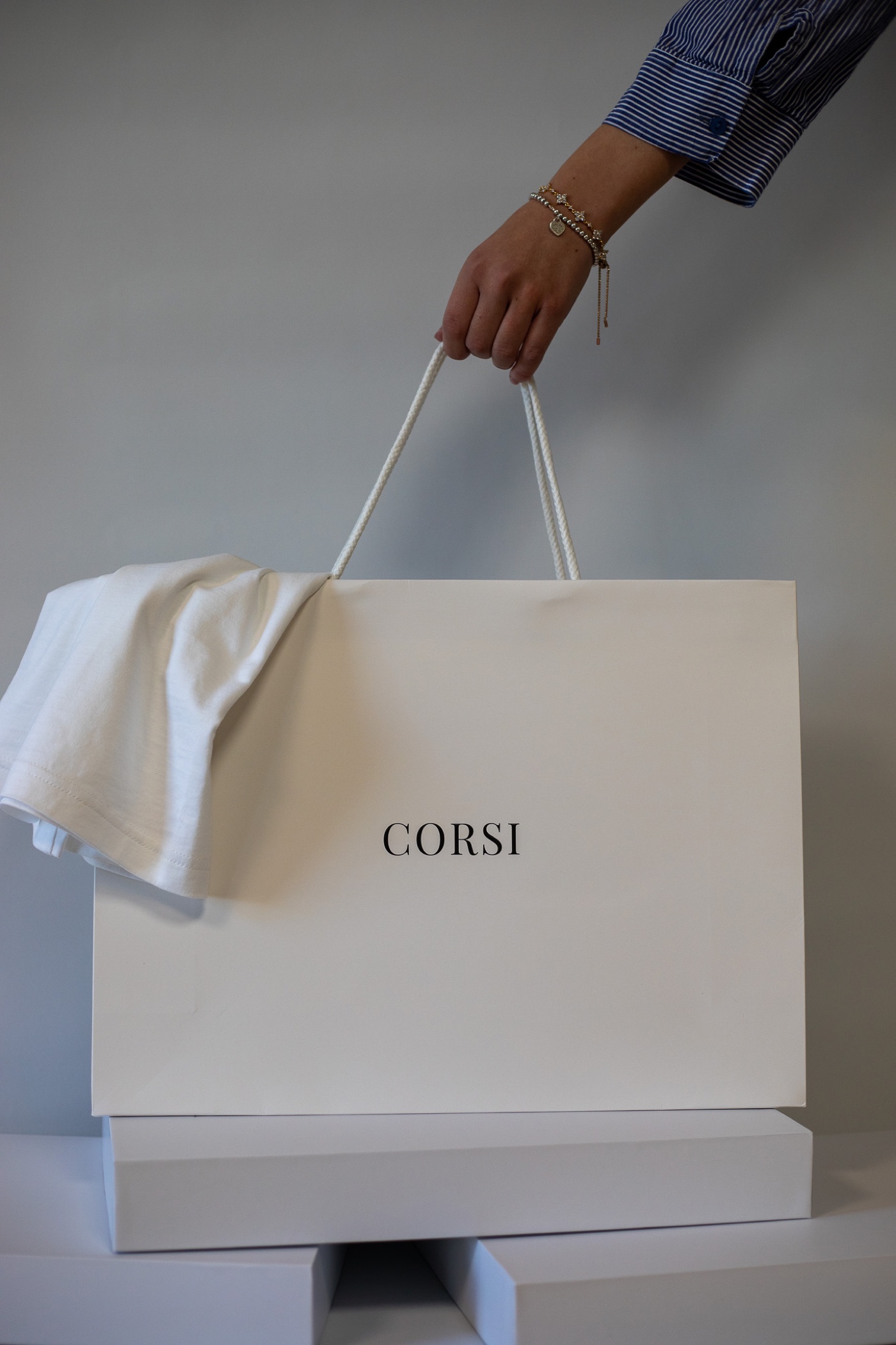 Corsi shopping bag held in one hand